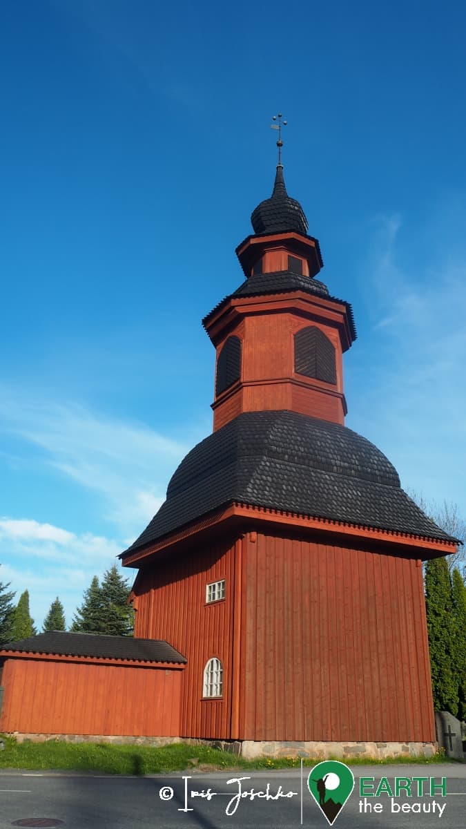 red wooden church in finland