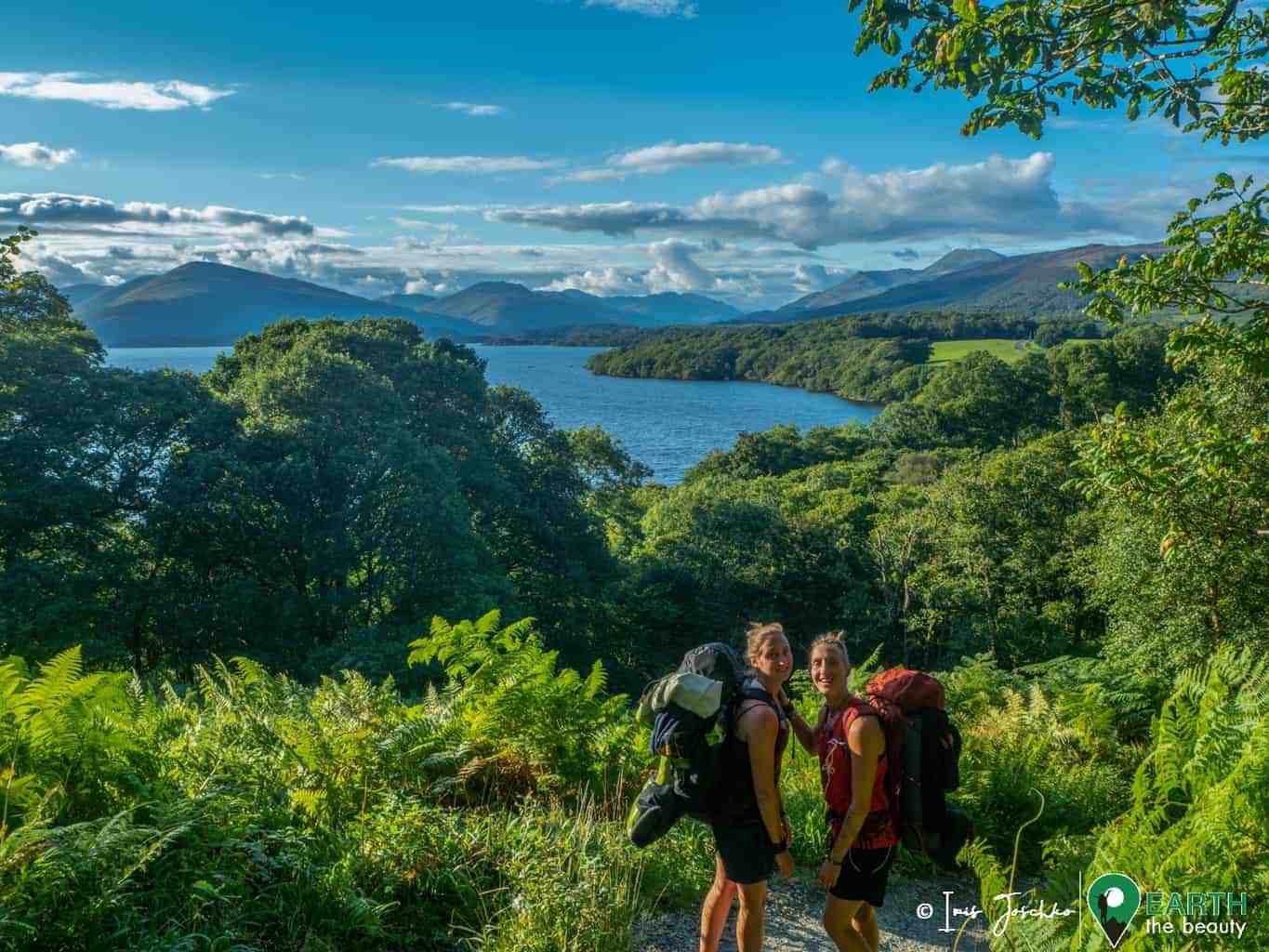 two girls hiking at a lake (loch lomond) on a beautiful sunny day